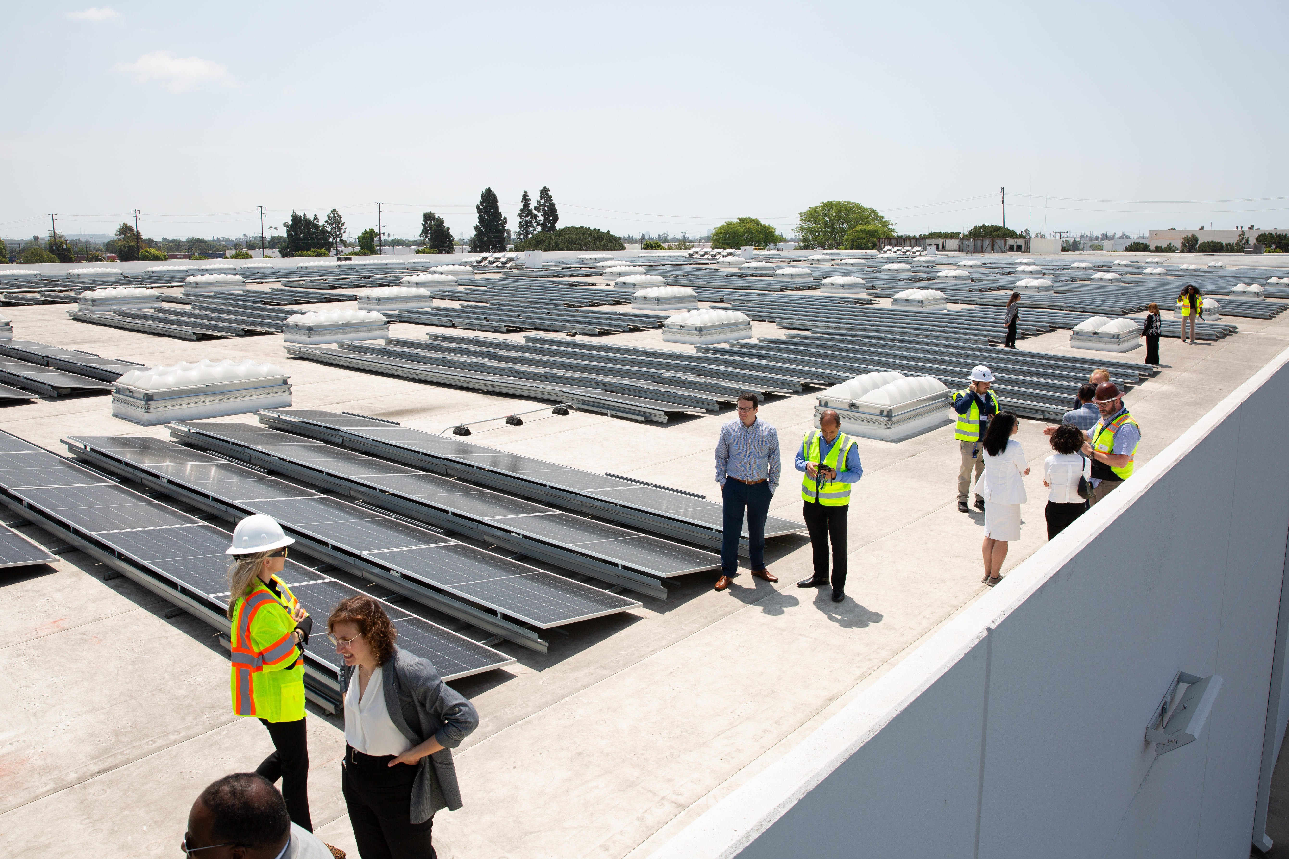 City officials and Prologis employees tour a rooftop during an...