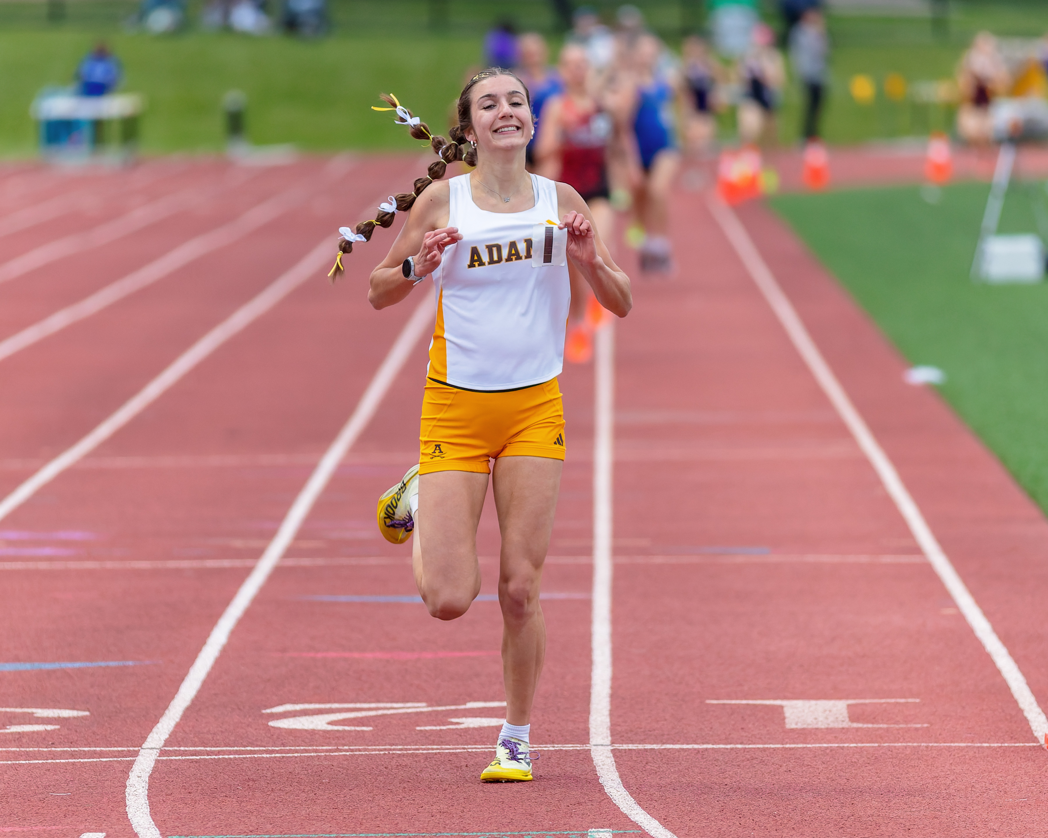 Rochester Adams' El McMahan wins the girls 1600m during the...