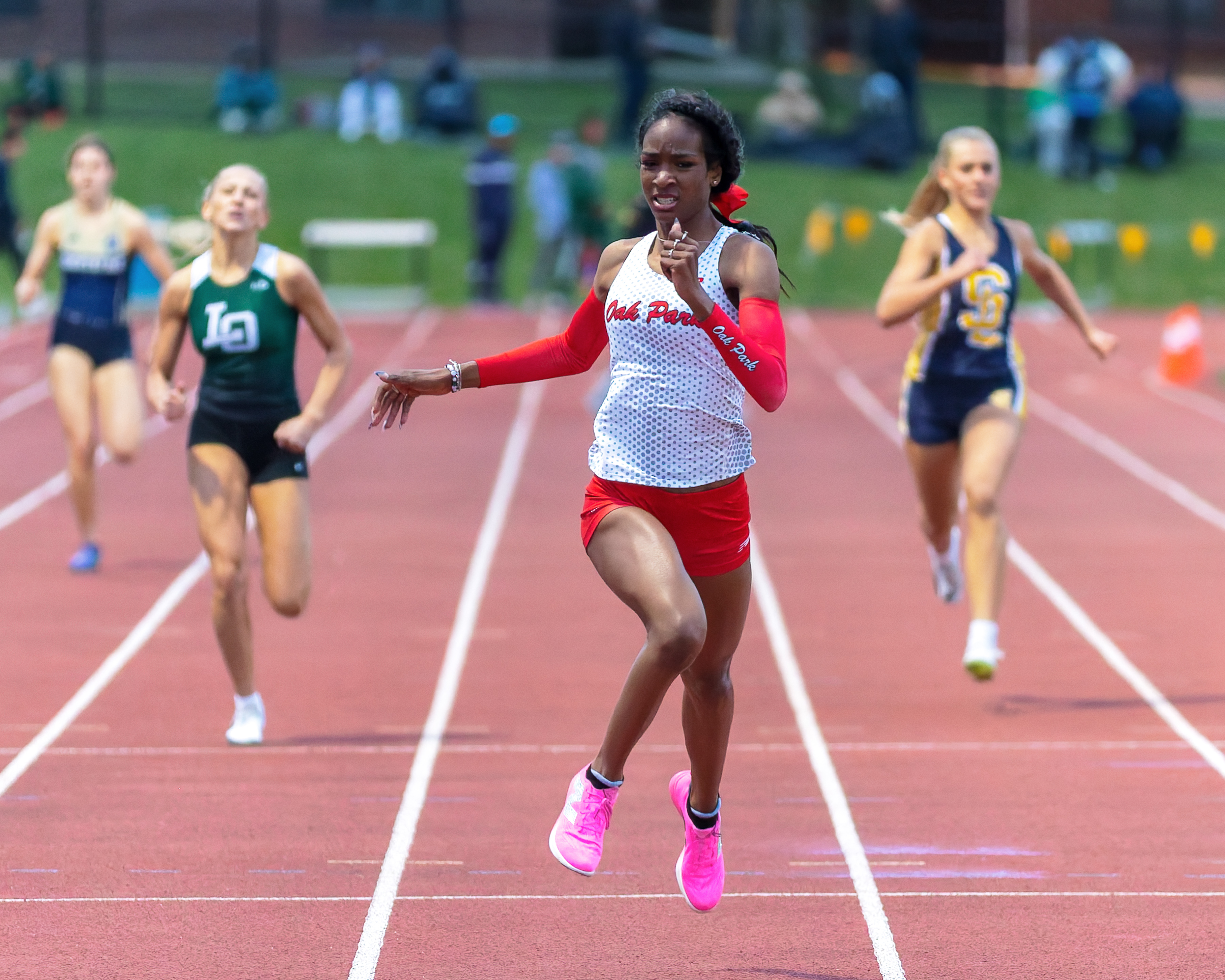 Oak Park's Nevaeh Burns wins the girls 400m during the...