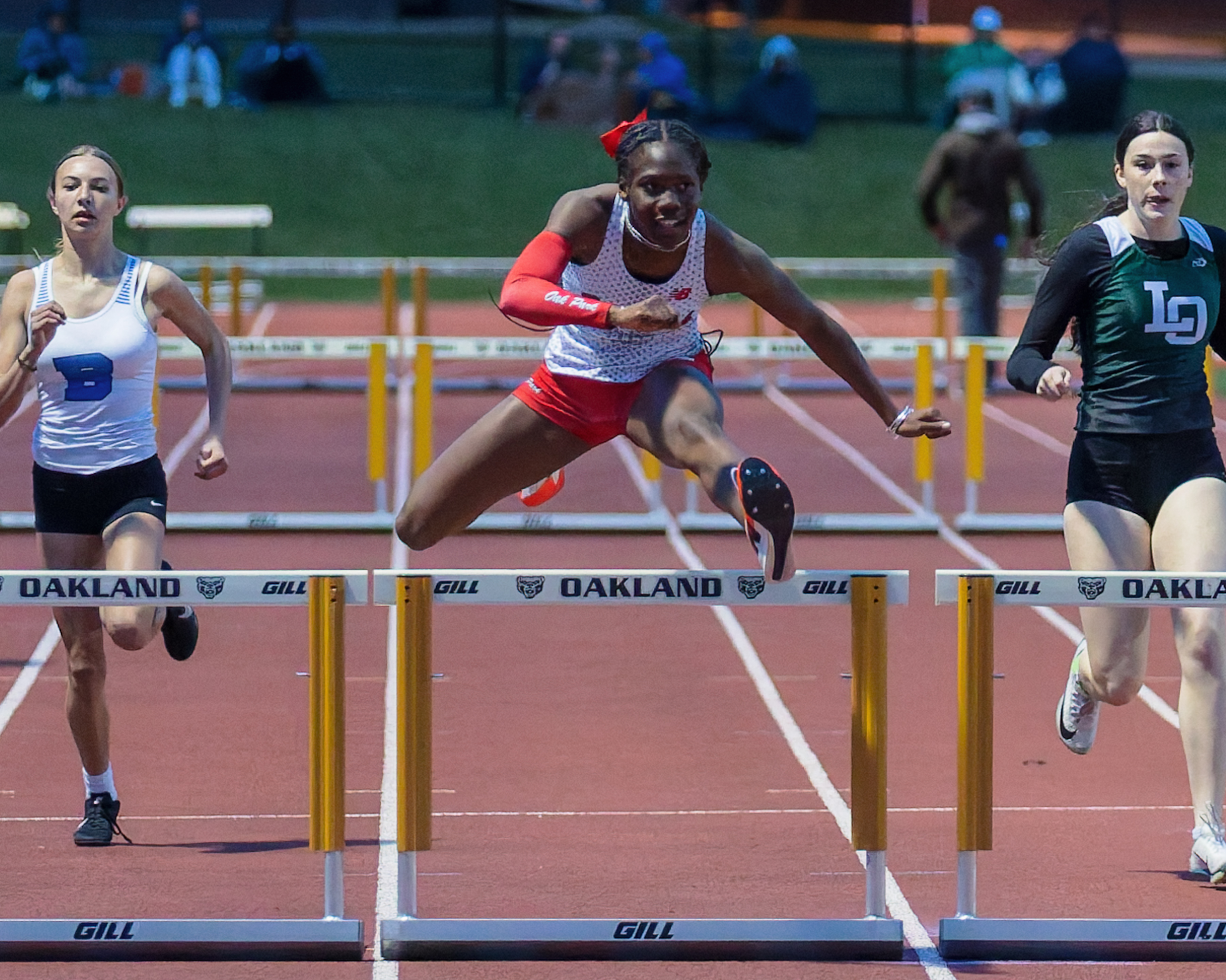 Oak Park's Payton Gee wins the girls 300m hurdles during...