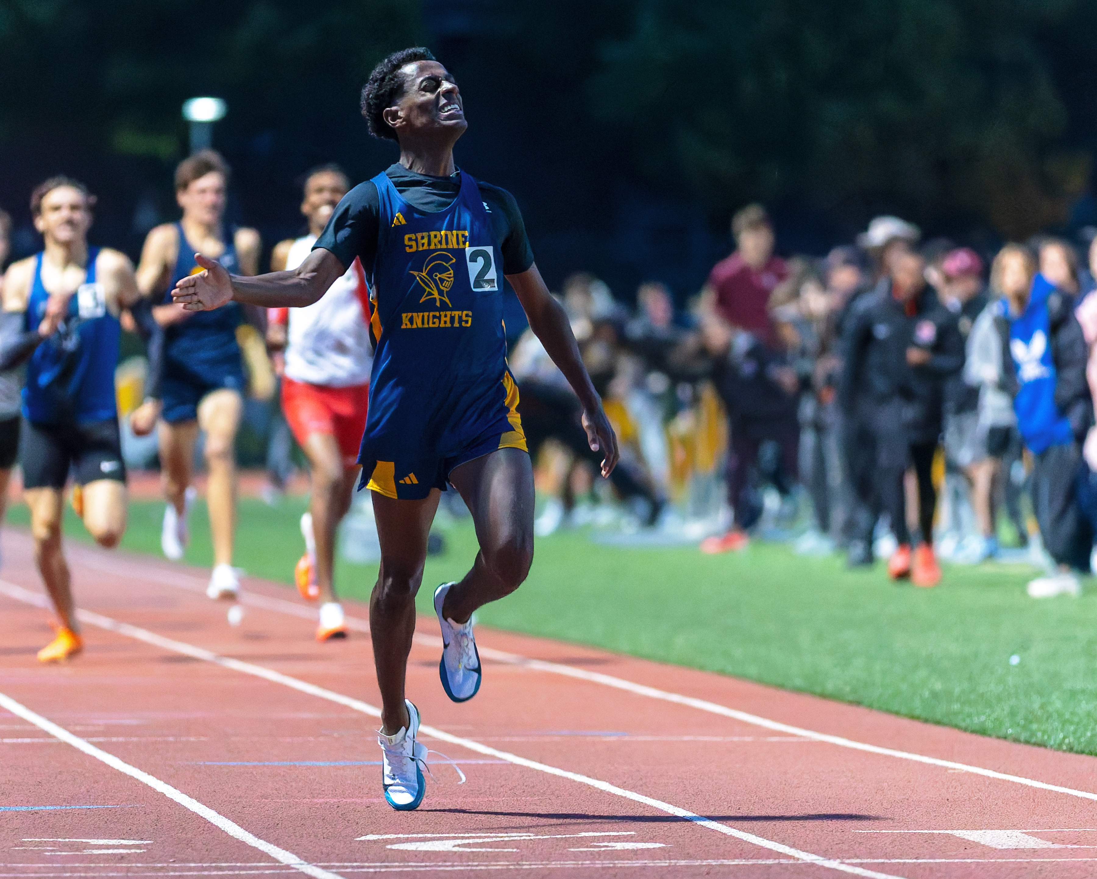 Royal Oak Shrine's Abenezer Cerone wins the boys 800m during...