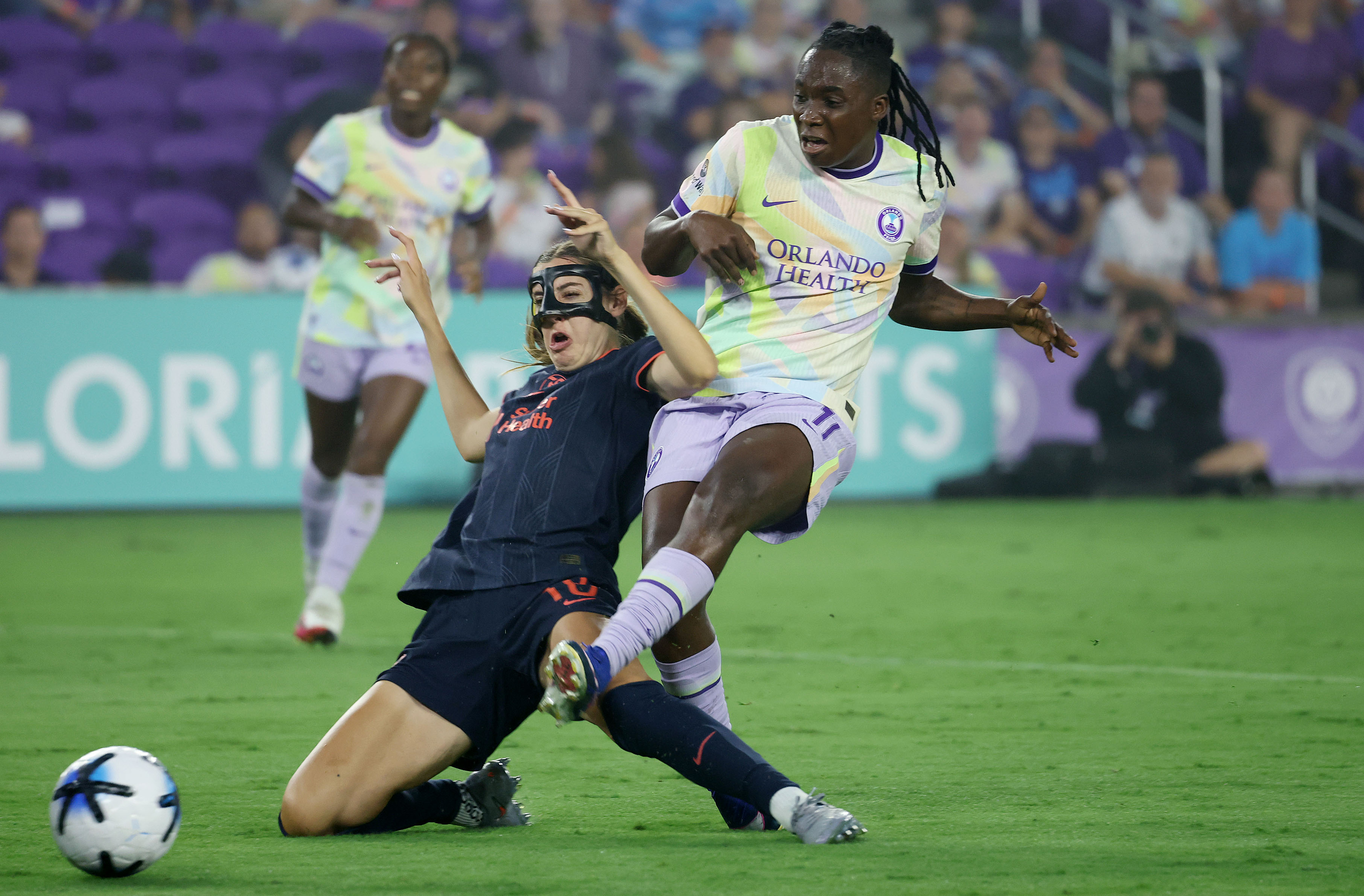 Orlando player Barbra Banda (11) scores a goal past falling...