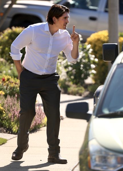 Eric Jones, Democratic challenger in the 4th Congressional District, signals to his campaign chief of staff Nick Sanitsky his intent to talk with one more prospective voter as he canvases a neighborhood in Lincoln, Wednesday, May 20, 2026. (Kent Porter / The Press Democrat)