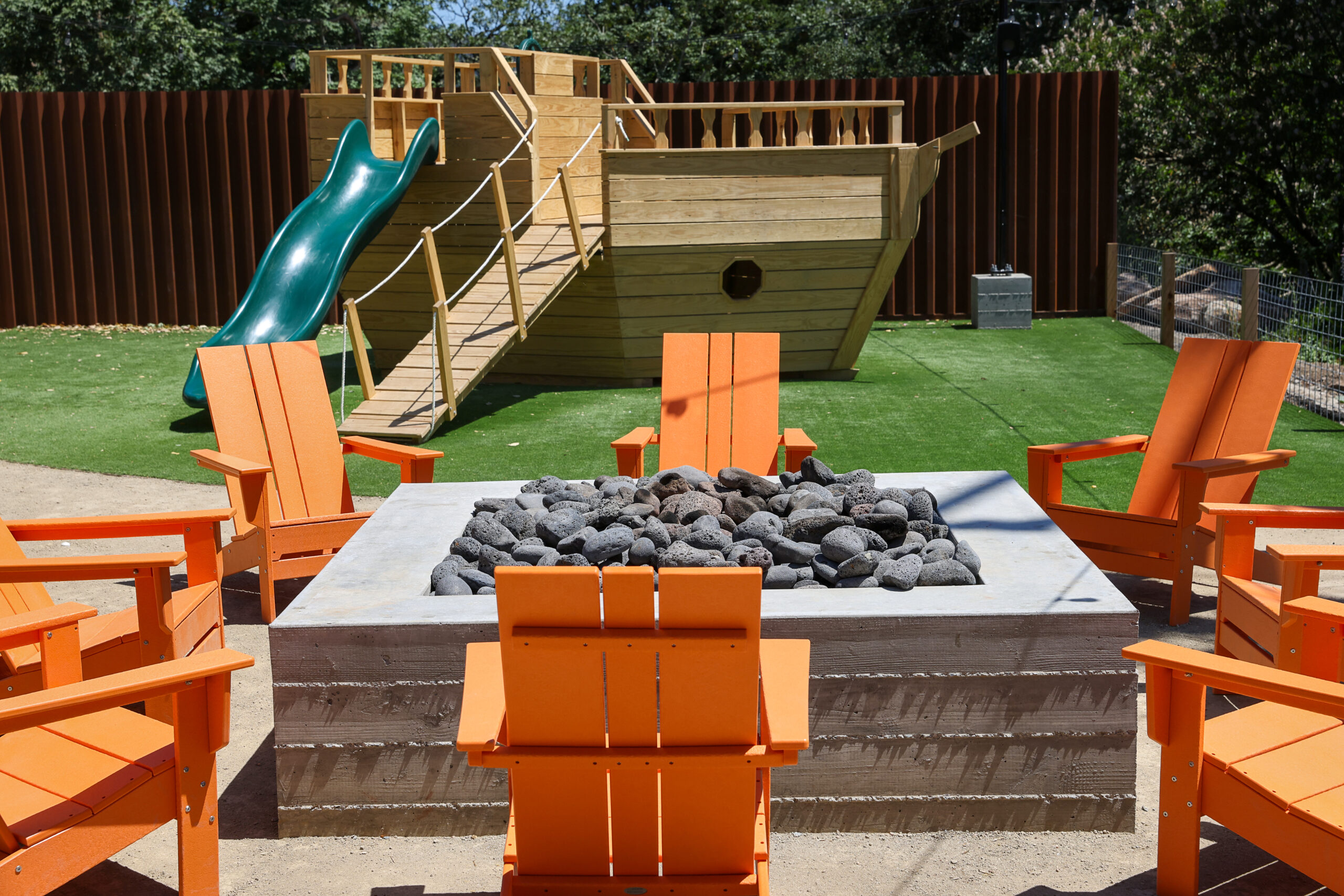 A fire pit and children’s ship play structure at The Junction in Santa Rosa
