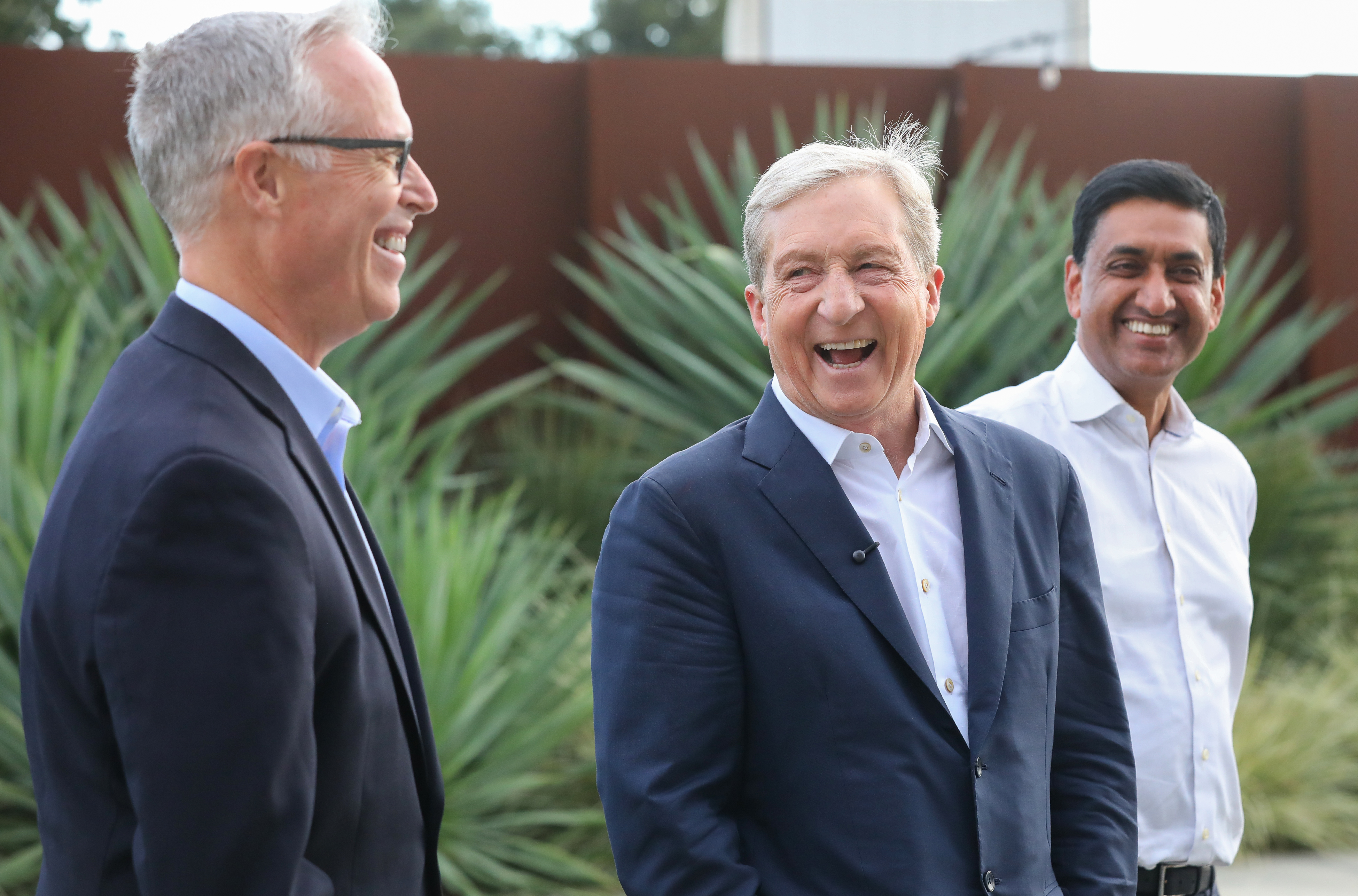 California gubernatorial candidate Tom Steyer, center laughs with U.S. Congressmen...