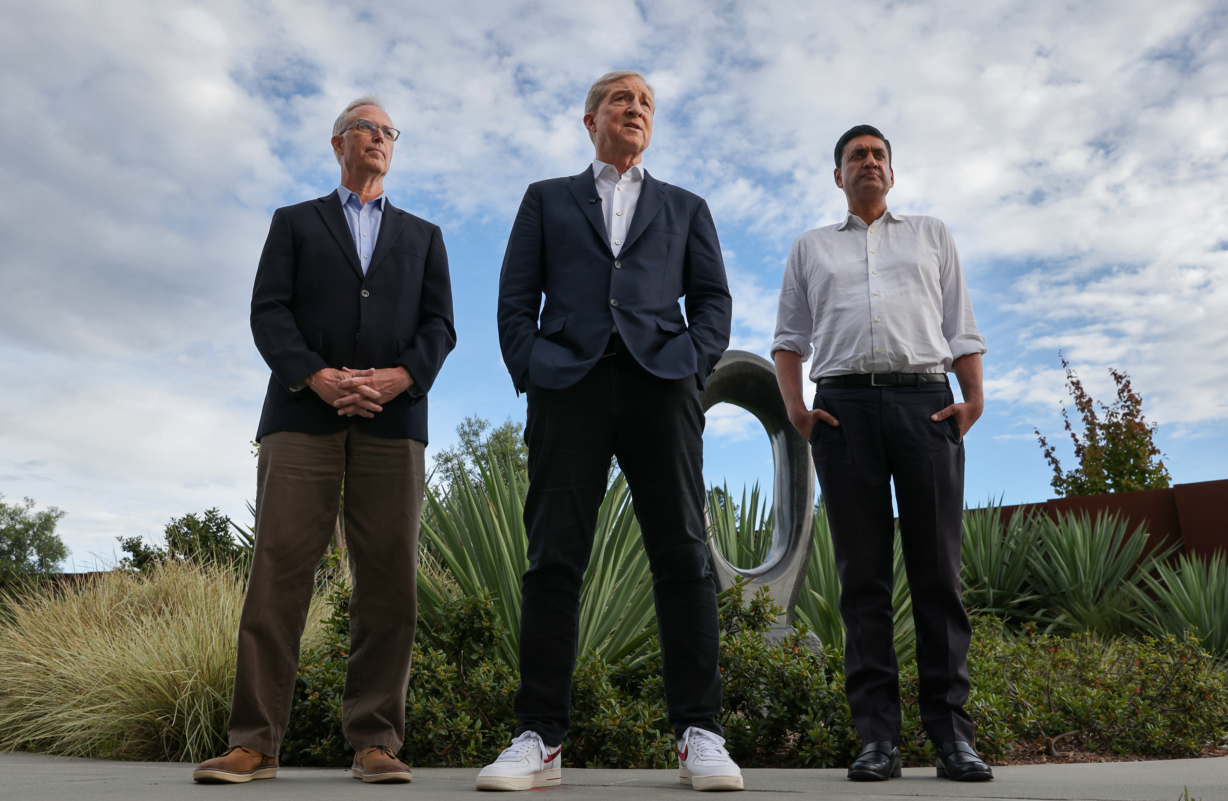 California gubernatorial candidate Tom Steyer, center, answers questions while flanked...