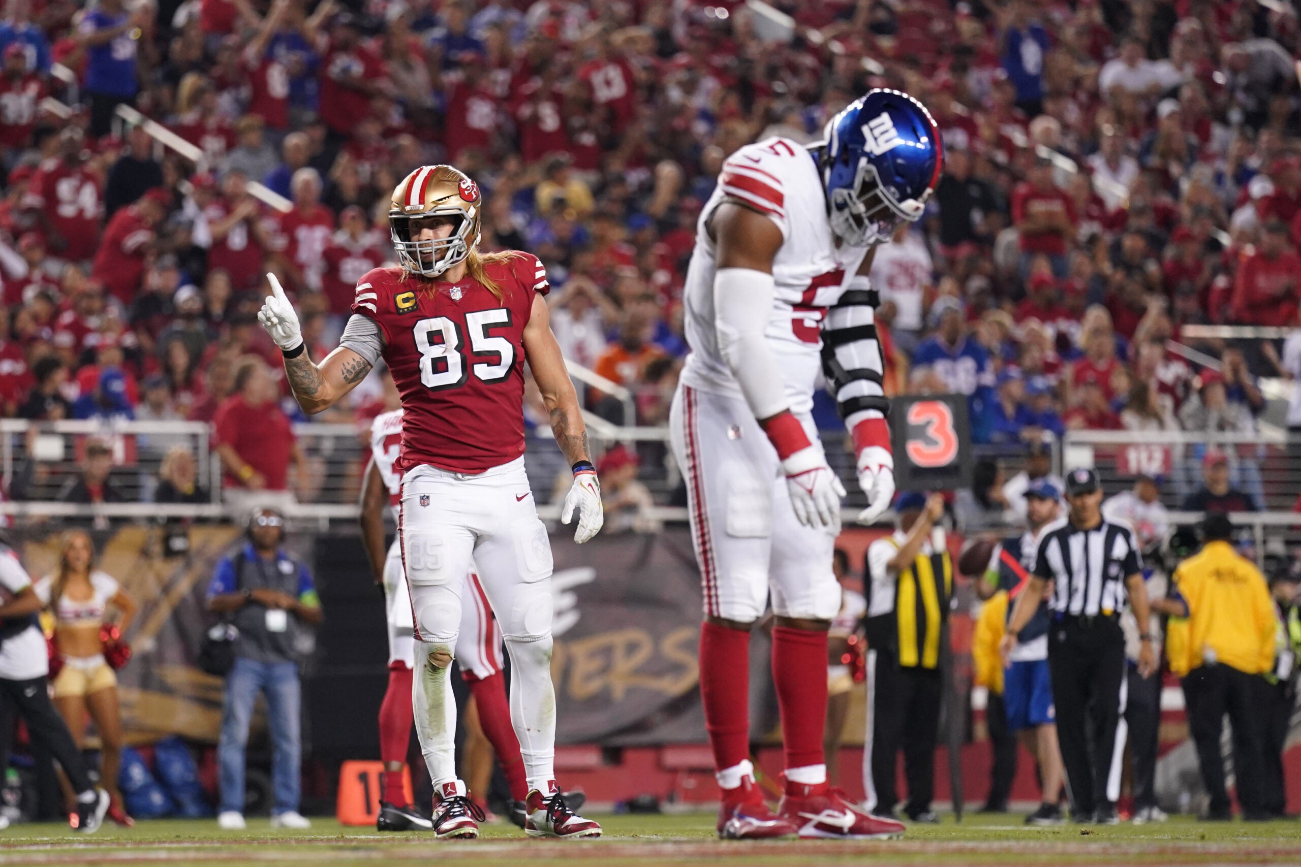 Sep 21, 2023; Santa Clara, California, USA; San Francisco 49ers tight end George Kittle (85) points his finger next to New York Giants linebacker Kayvon Thibodeaux (5) after the Giants were called for a penalty in the third quarter at Levi's Stadium.