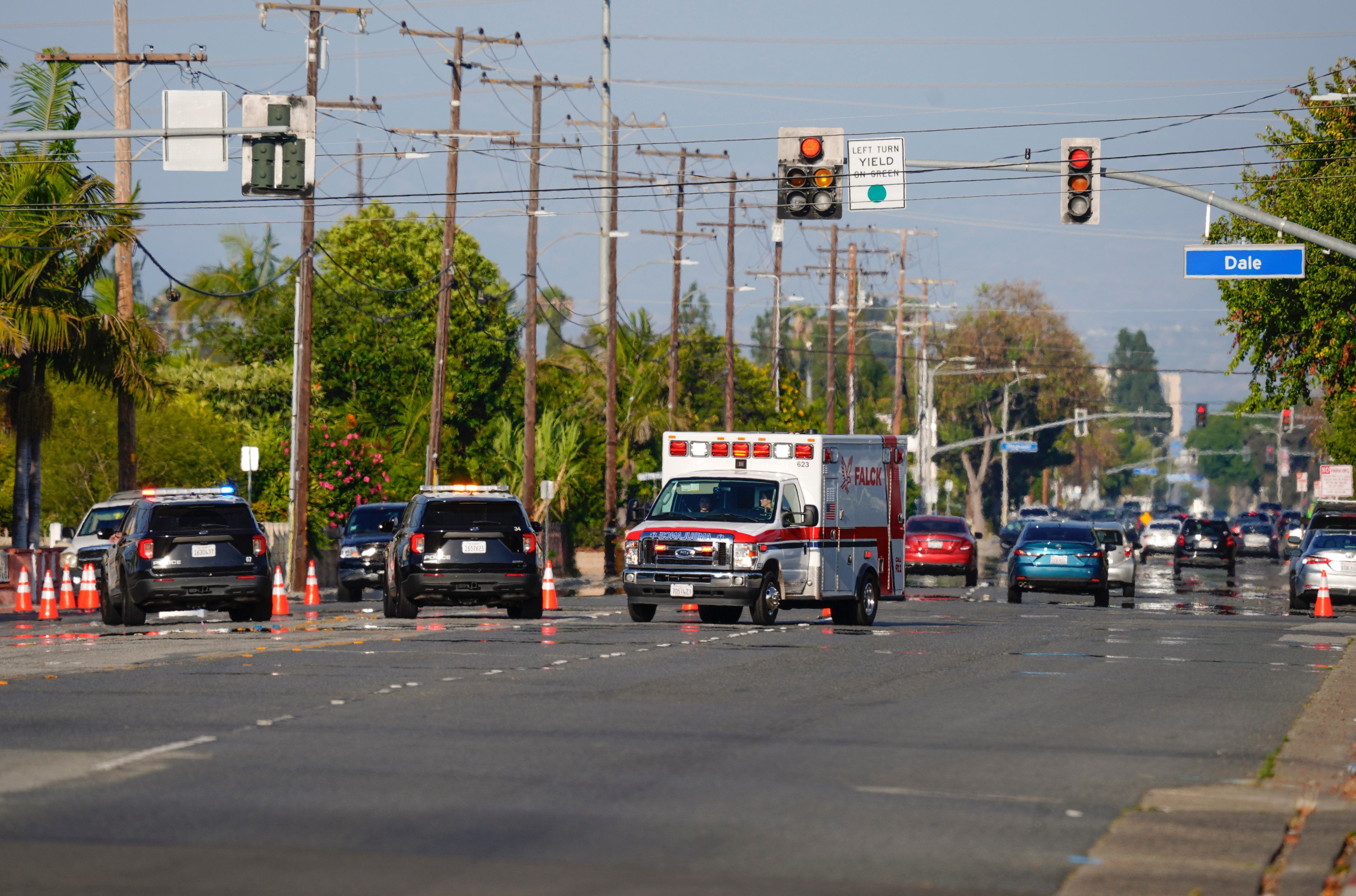 An ambulance bypasses a police blockage on West Chapman Avenue and Dale St. during a mandatory evacuation of the surrounding neighborhoods near the GKN Aerospace facility in Garden Grove, Calif., May 23, 2026.