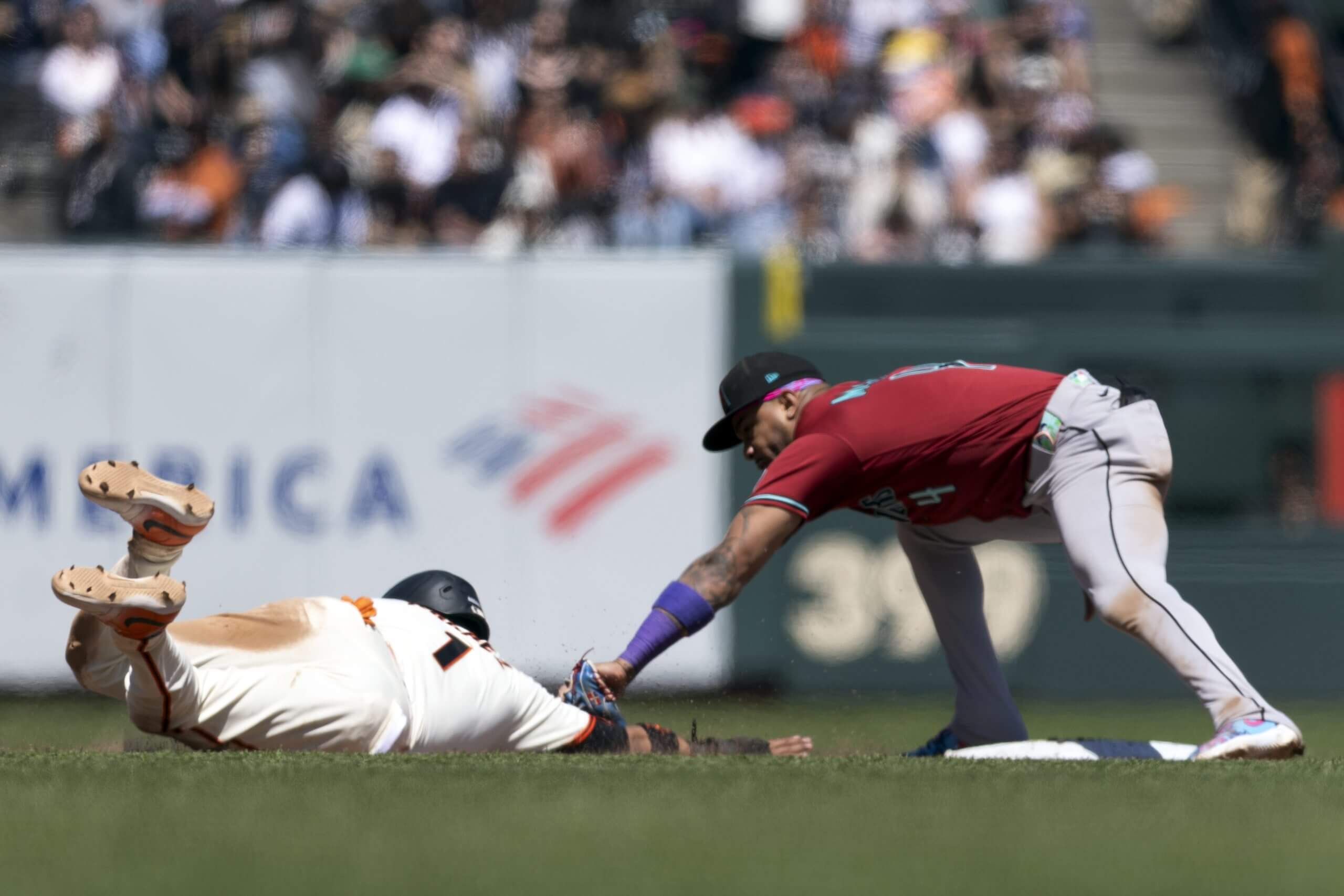 Arizona Diamondbacks second baseman Ketel Marte tags out San Francisco Giants second baseman Luis Arraez.