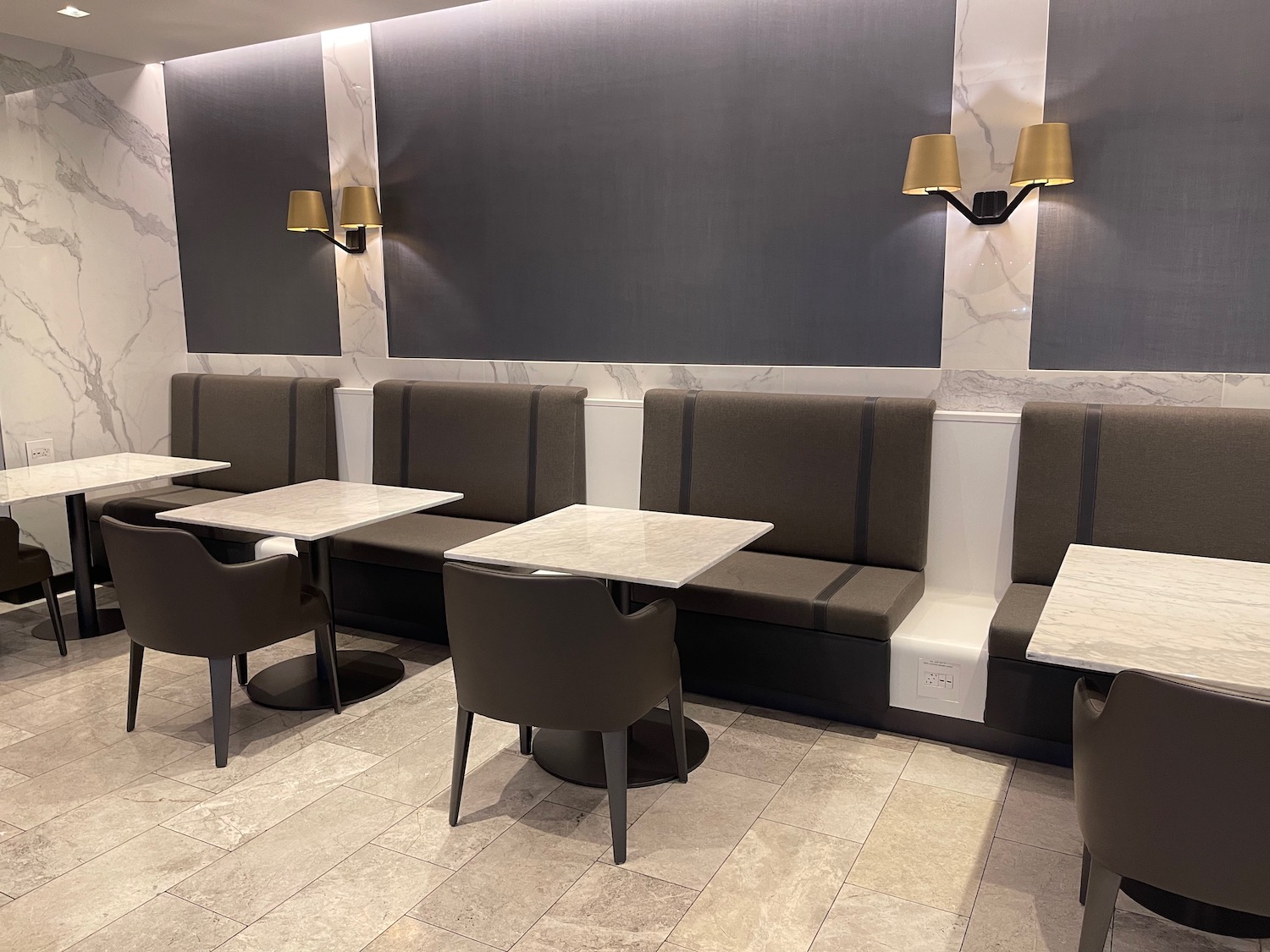 a booth seating with tables and chairs