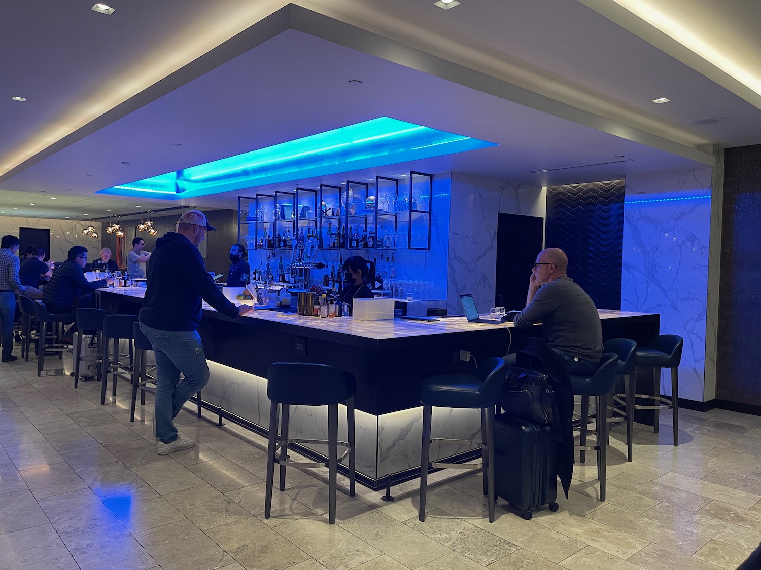a group of people at a bar