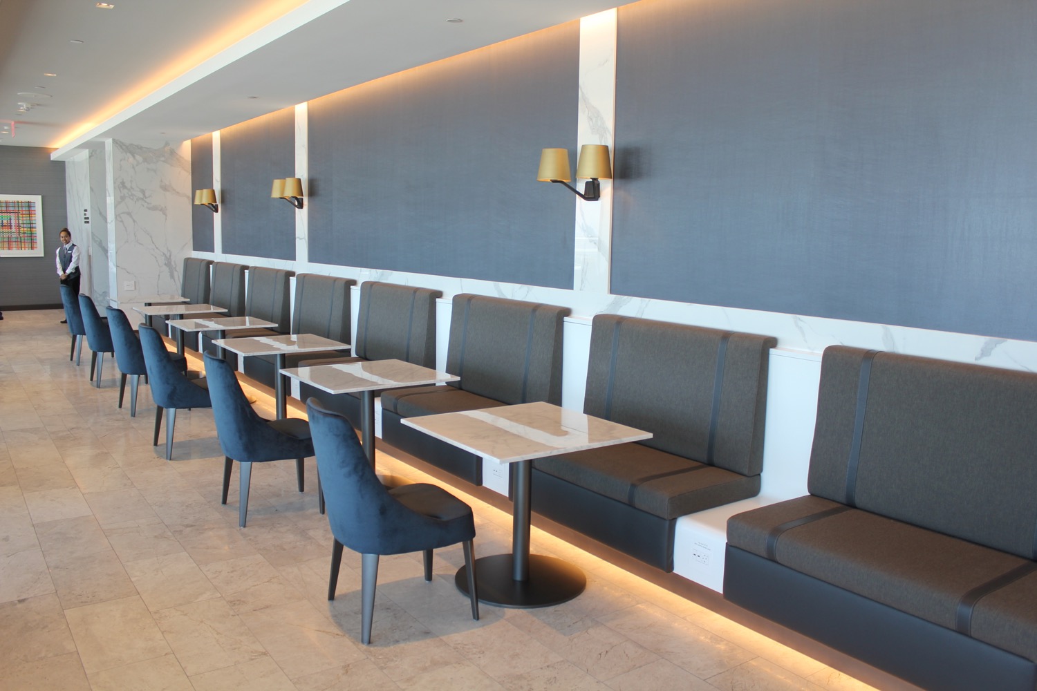 a row of tables and chairs in a restaurant