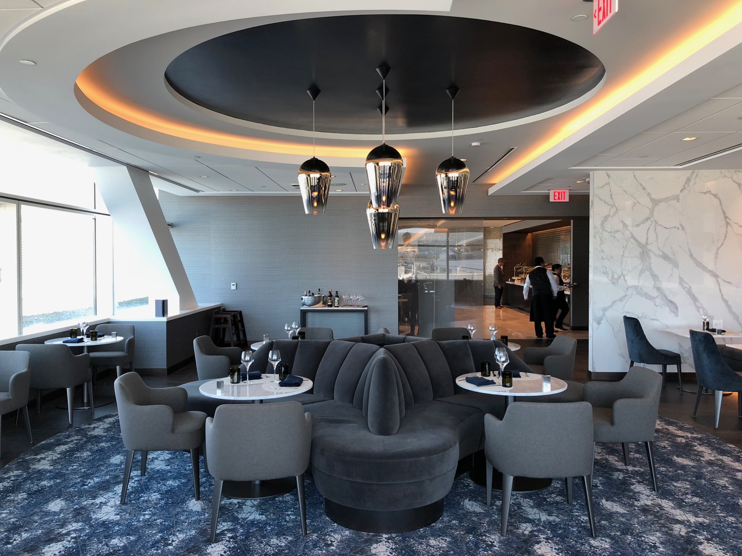 a room with a round table and chairs