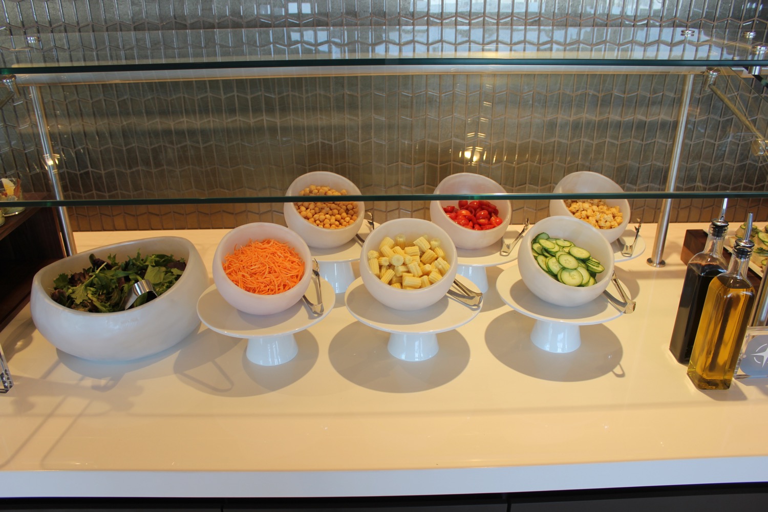 a row of bowls of food