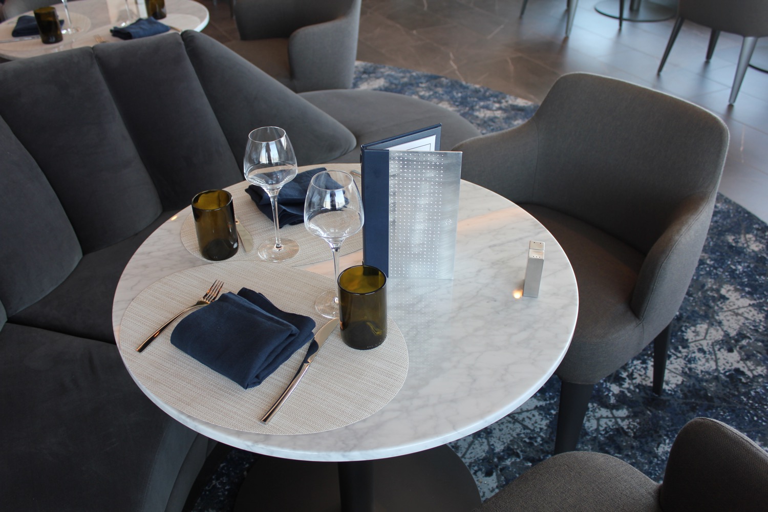 a table with glasses and napkins on it