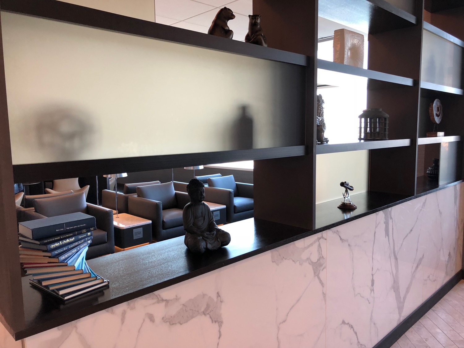 a shelf with a statue on it