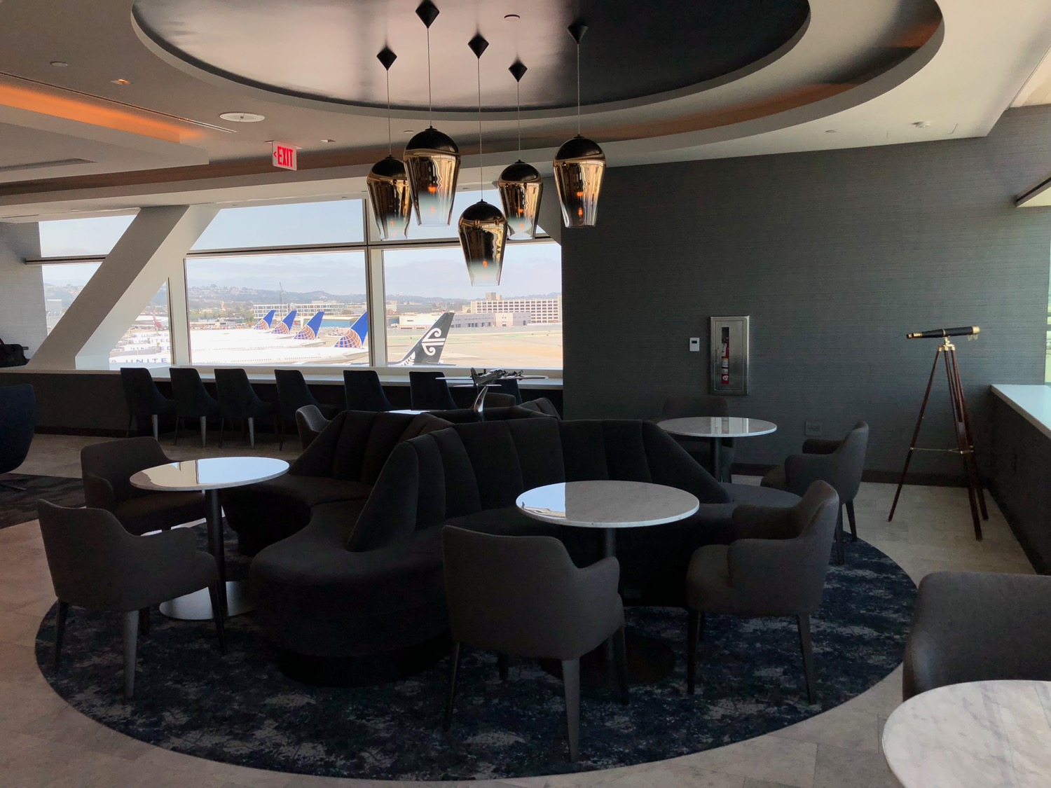 a lounge area with tables and chairs
