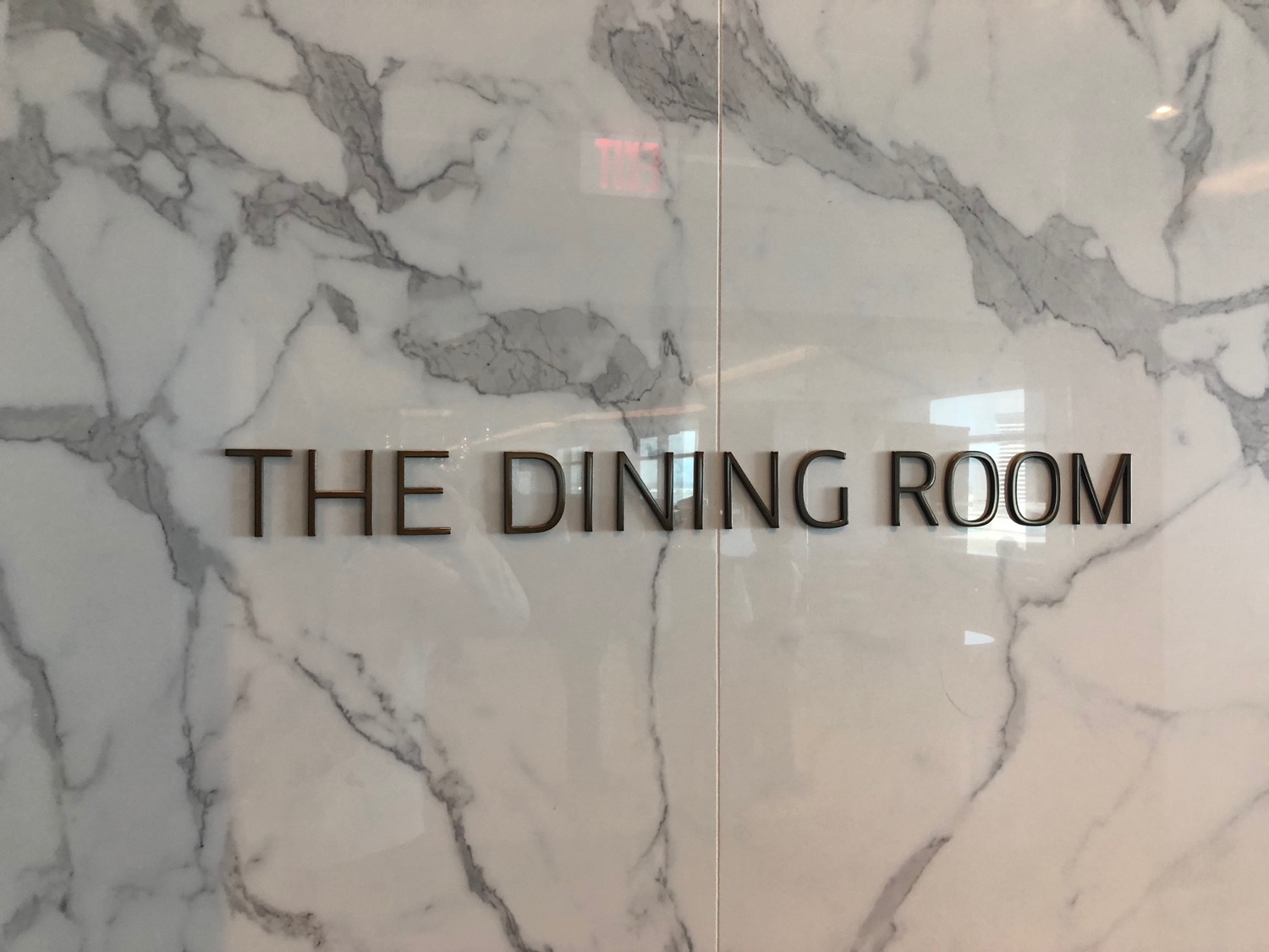 a sign on a marble wall
