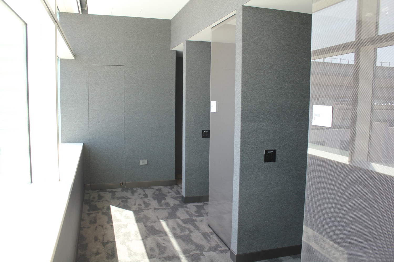 a room with grey walls and a window