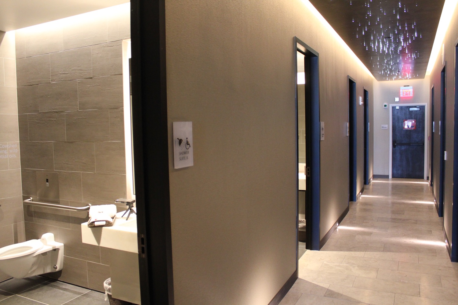 a hallway with doors and a sink