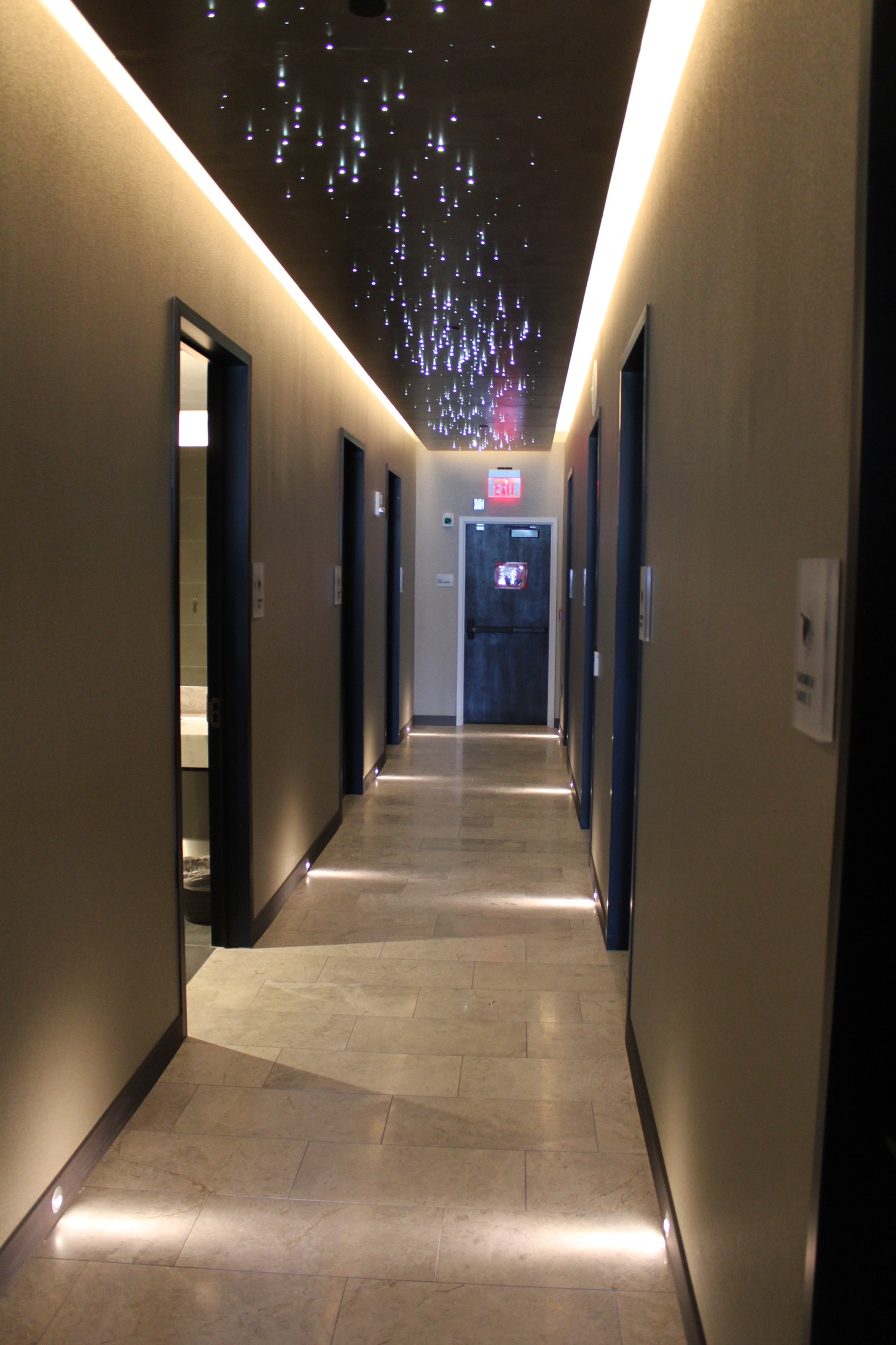 a hallway with lights on the ceiling