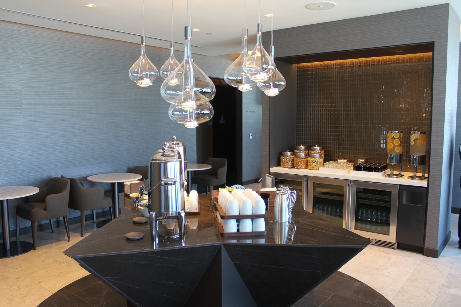 a room with a black table and a black counter with a black counter with a black counter with a black counter with a black counter with a black counter with a black counter with a black counter with