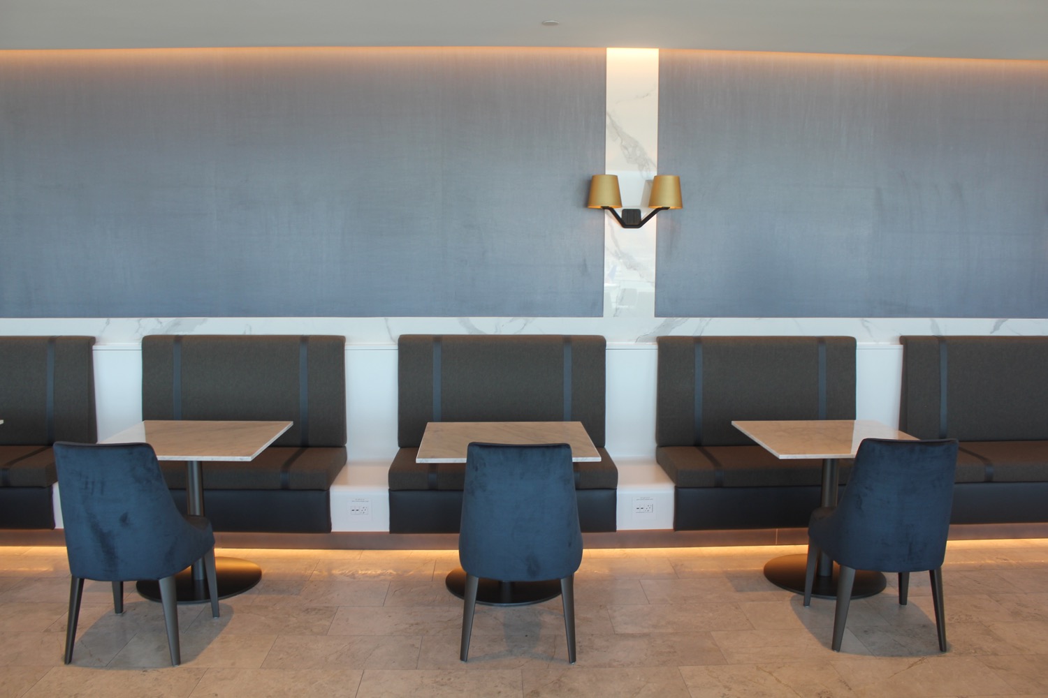 a group of tables and chairs in a room