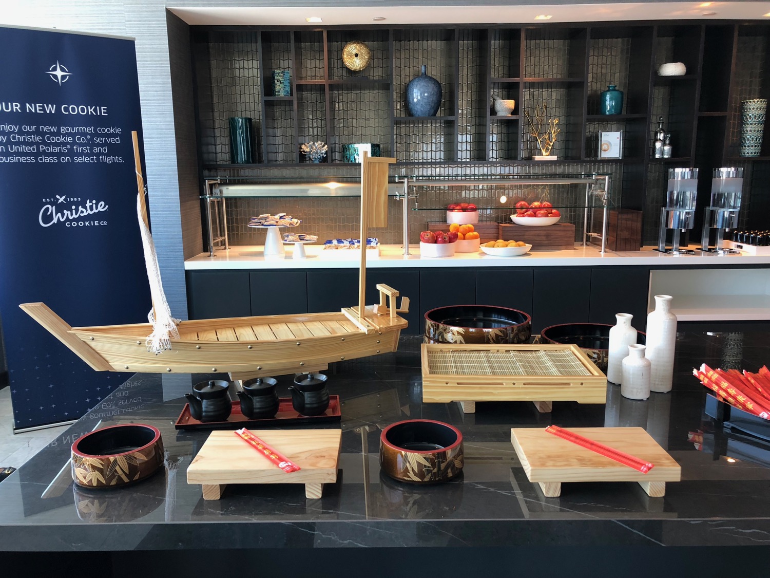 a table with a boat and bowls on it