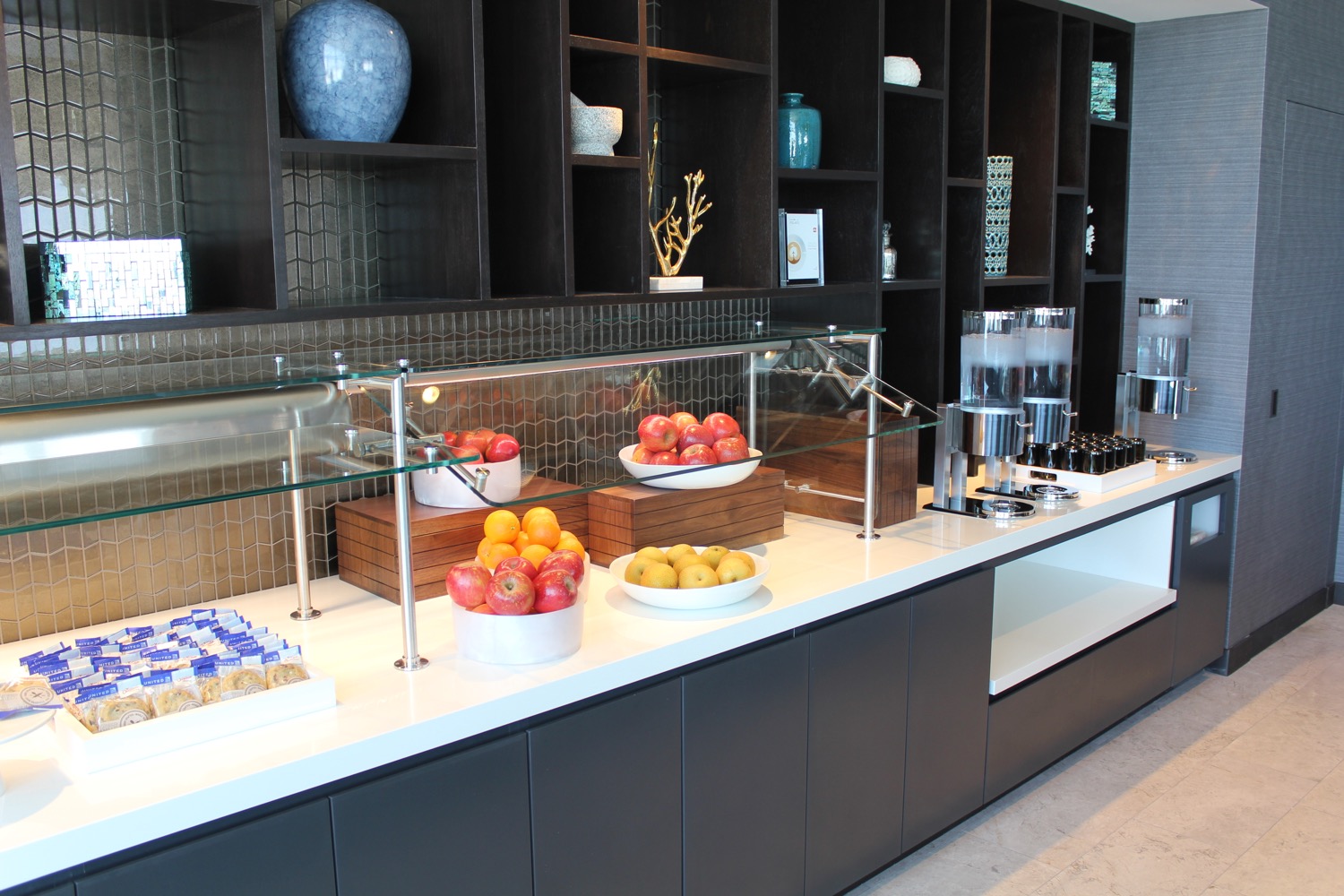 a counter with fruit in bowls