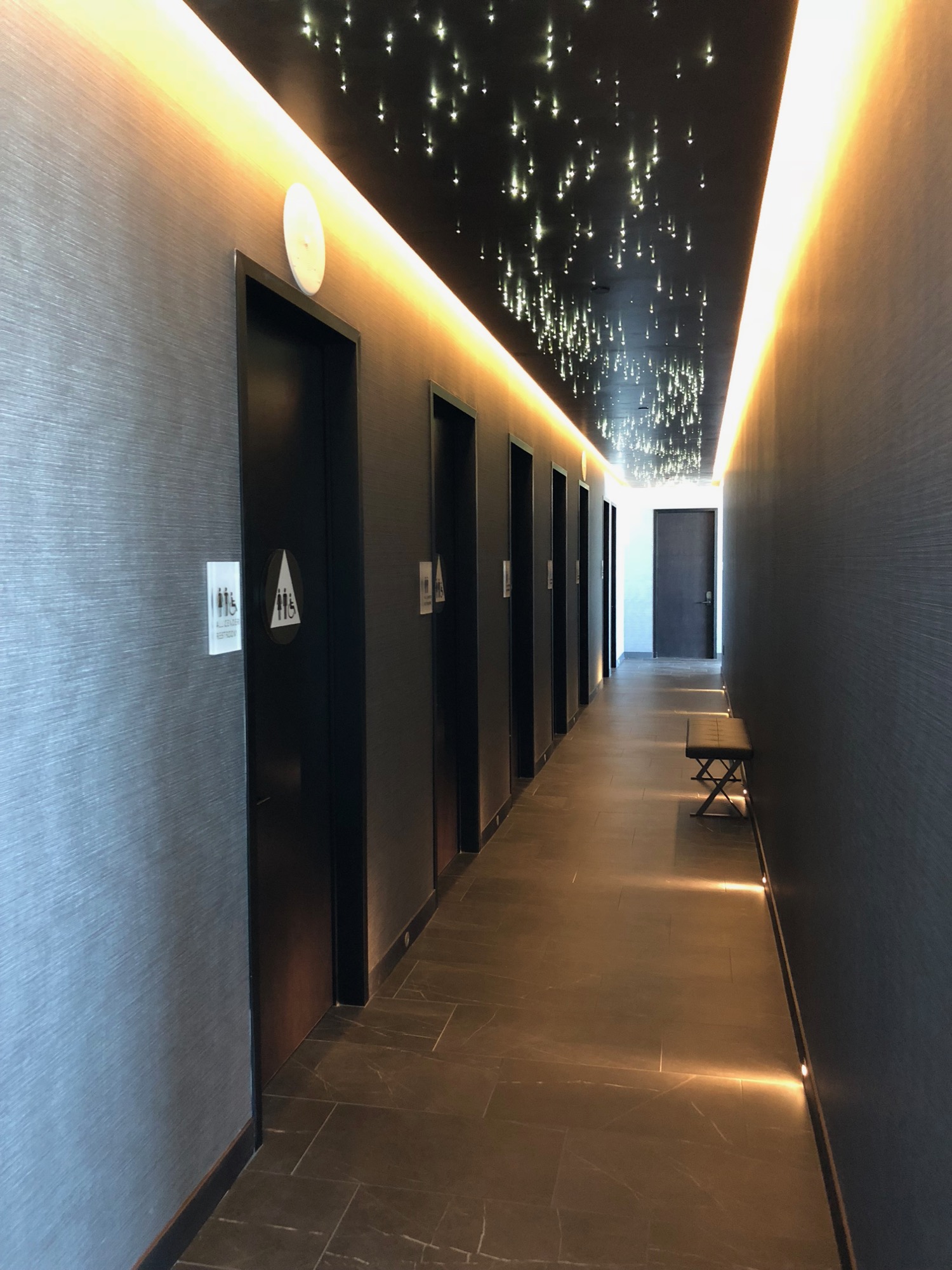 a hallway with doors and lights