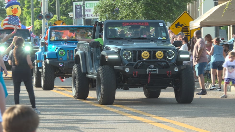 A Mardi Gras-style Jeep parade rolled through downtown Long Beach on Saturday evening as part...