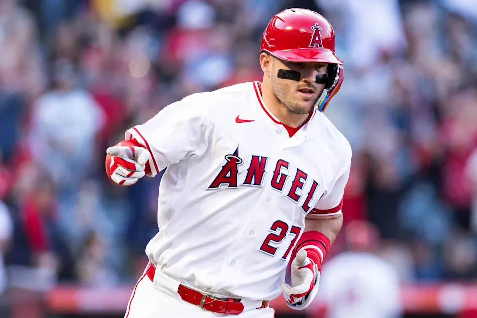 Mike Trout #27 of the Los Angeles Angels celebrates after hitting a home run during an MLB game against the Texas Rangers on May 23, 2026 at Angel Stadium in Anaheim, California.