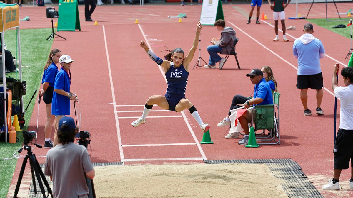 AB Hernandez jumping during girls long jump event at track meet