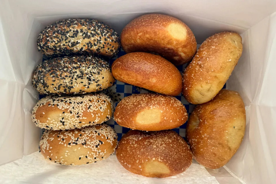 A bag filled with a dozen assorted bagels from Daniel’s Bagels.