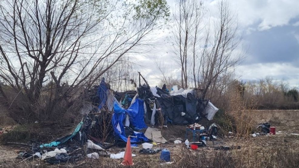 Bakersfield Police and other authorities, such as park rangers, work to clear out homeless encampments along the Kern River bed in Bakersfield on Wednesday, Feb. 19, 2025. PHOTO: BPD
