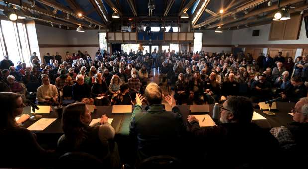 During a sometimes contentious meeting at the Point Reyes Dance Palace held to explain the decision to buy out dairy and cattle ranchers in Point Reyes National Seashore, Rep. Jared Huffman gives a statement. To Huffman's left is Point Reyes National Seashore superintendent Anne Altman and outreach coordinator Melanie Gunn. At right is Marin County Supervisor Dennis Rodoni and rancher Kevin Lunny. (Kent Porter / The Press Democrat)
