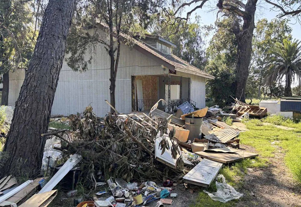 Trash and debris litters the yard at 8932 Florin Road in Sacramento County in March. The boarded up home on a 1-acre parcel was sold at a tax auction for $410,051 in May 2025.