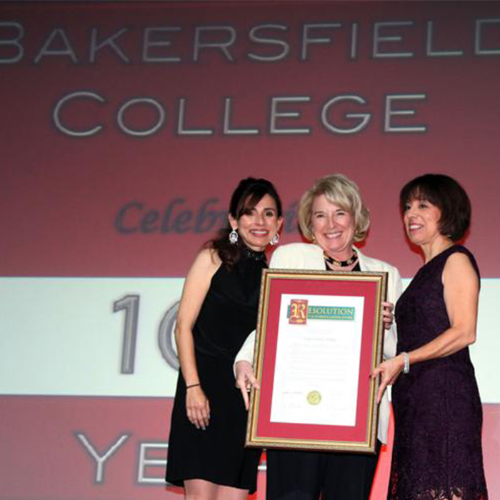 Jean Fuller presenting a resolution to then BC presiddent and then KCCD Chancellor