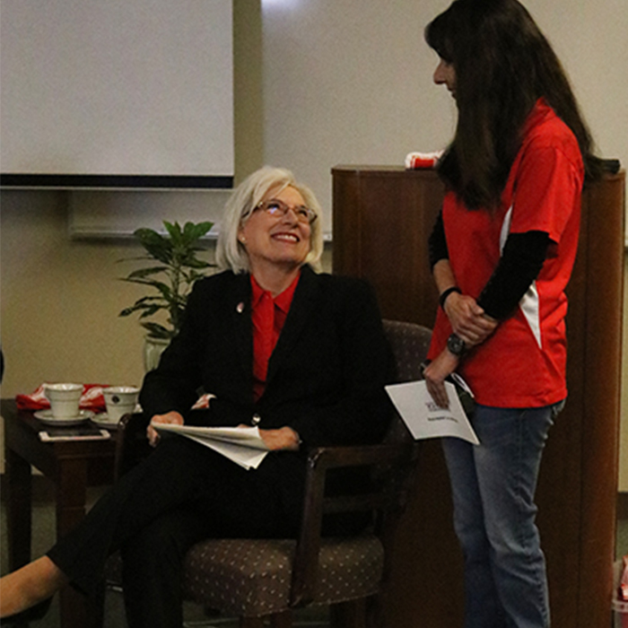 two adult females interacting