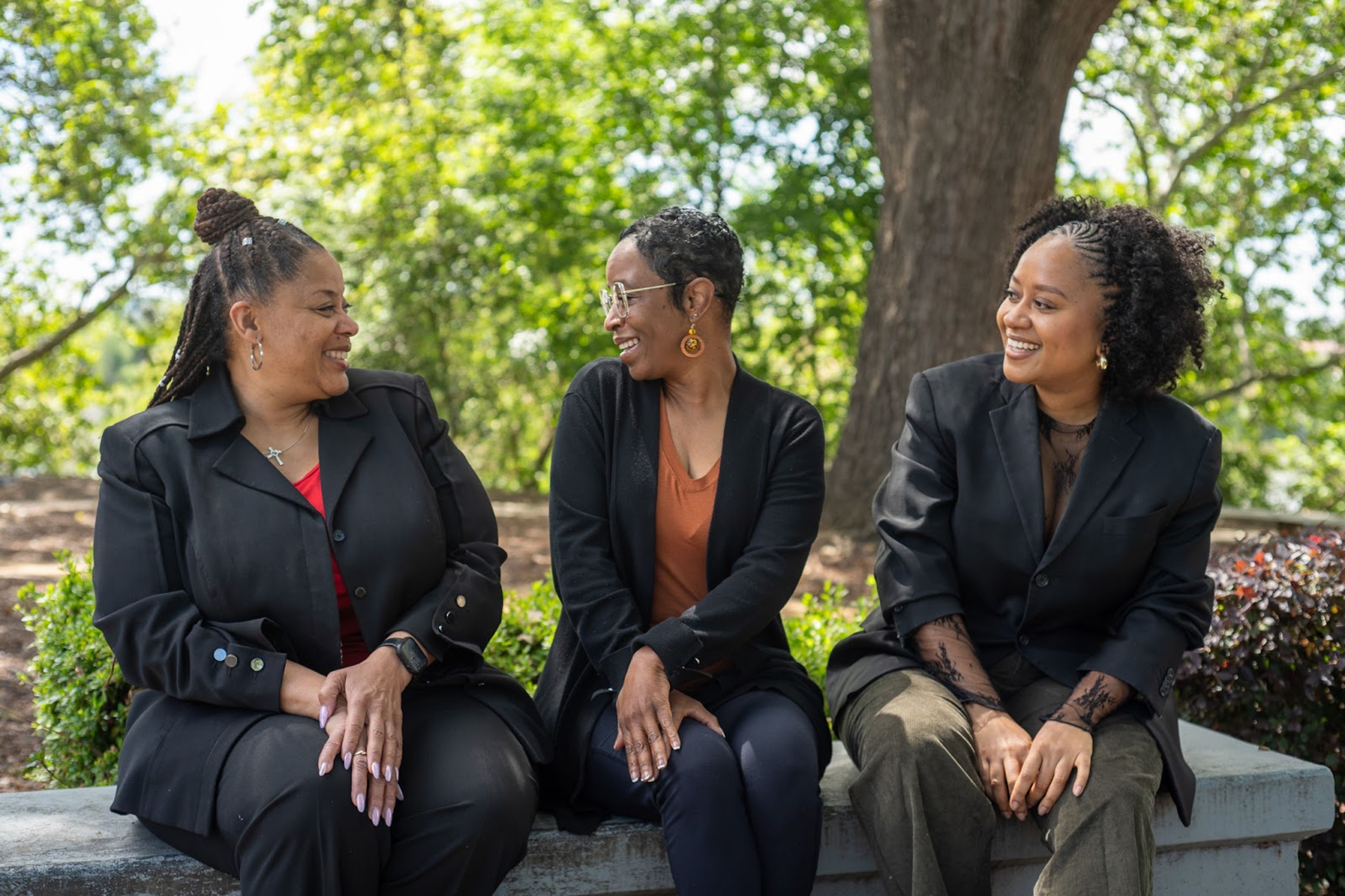 From left, ​​Kim Williams, Danielle Lawrence and Jedida Gomes outside of the Black Child Legacy Campaign office April 24.