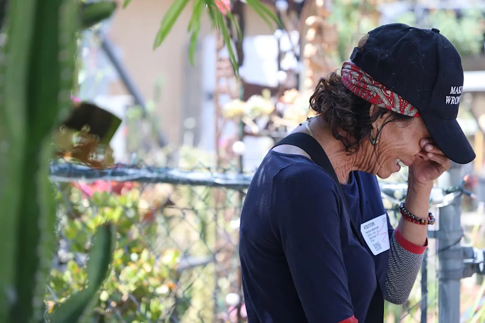 Sheron’s wife, Maria, in tears outside the home on Thursday. John Gastaldo for CA Post