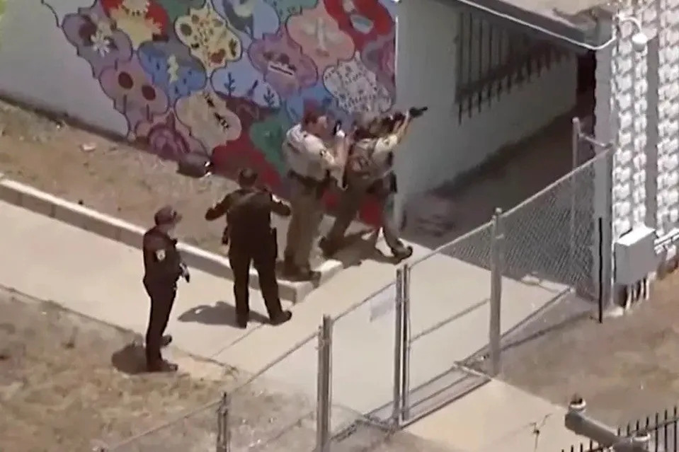 Law enforcement officers respond to the shooting at the Islamic Center of San Diego