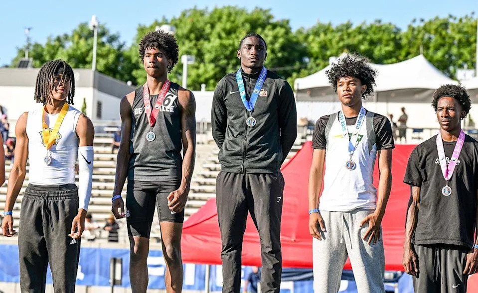 Clovis West's Julius Sanders center takes the top position during the awards presentation after winning the boys' long jump during the CIF state track and field championships at Veterans Memorial Stadium in Clovis on Saturday, May 30, 2026.