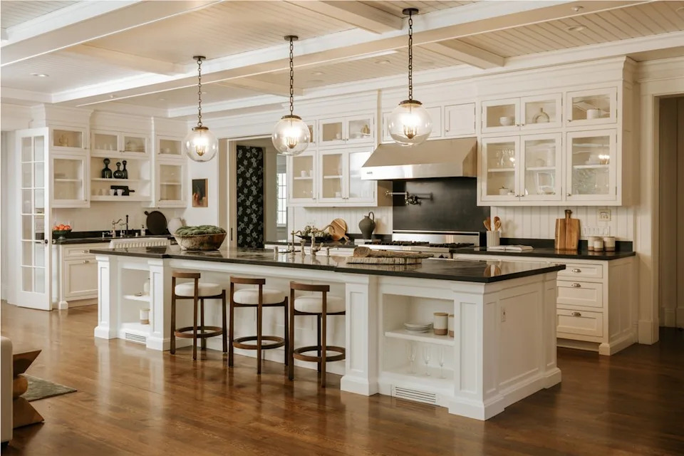 The open-plan kitchen and living room area serves as the heart of the property—which is listed with Cindy Ambuehl of Christie's International Real Estate Southern California—offering ample space for entertaining. <span class="image-credit">(Christian Cruzio Studios)</span>
