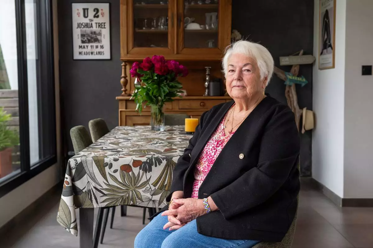 Marie-Therese Ross-Mahe, an 85-year-old French widow of a U.S. military veteran, poses in Orvault, western France, during an interview with The Associated Press, Monday, May 11, 2026. (AP Photo/Mathieu Pattier)