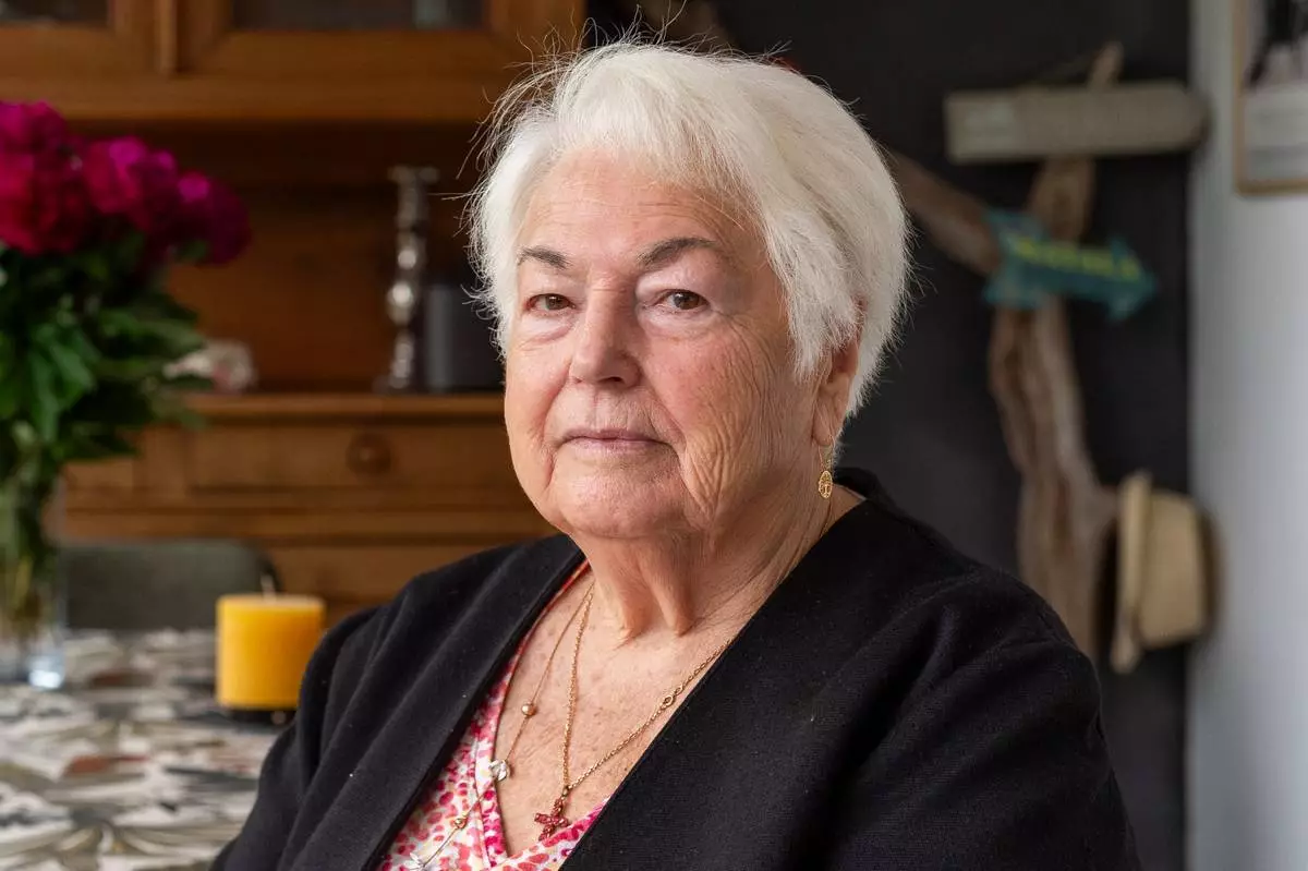 Marie-Therese Ross-Mahe, an 85-year-old French widow of a U.S. military veteran, poses in Orvault, western France, during an interview with The Associated Press, Monday, May 11, 2026. (AP Photo/Mathieu Pattier)