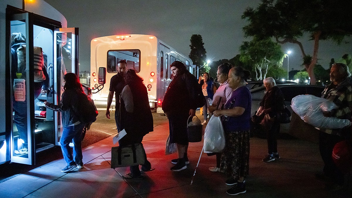 Evacuees moving to another shelter after aerospace chemical plant tank leak in Garden Grove Calif