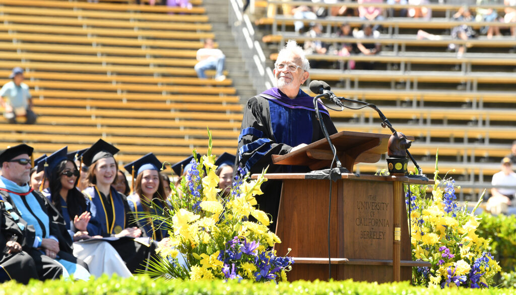Robert Reich speaks to Berkeley graduates from a podium