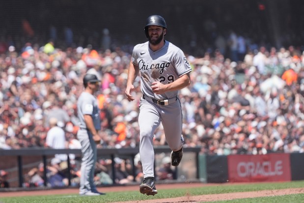 Chicago White Sox's Tristan Peters runs home to score against the San Francisco Giants during the fifth inning of a baseball game Saturday, May 23, 2026, in San Francisco. (AP Photo/Jeff Chiu)