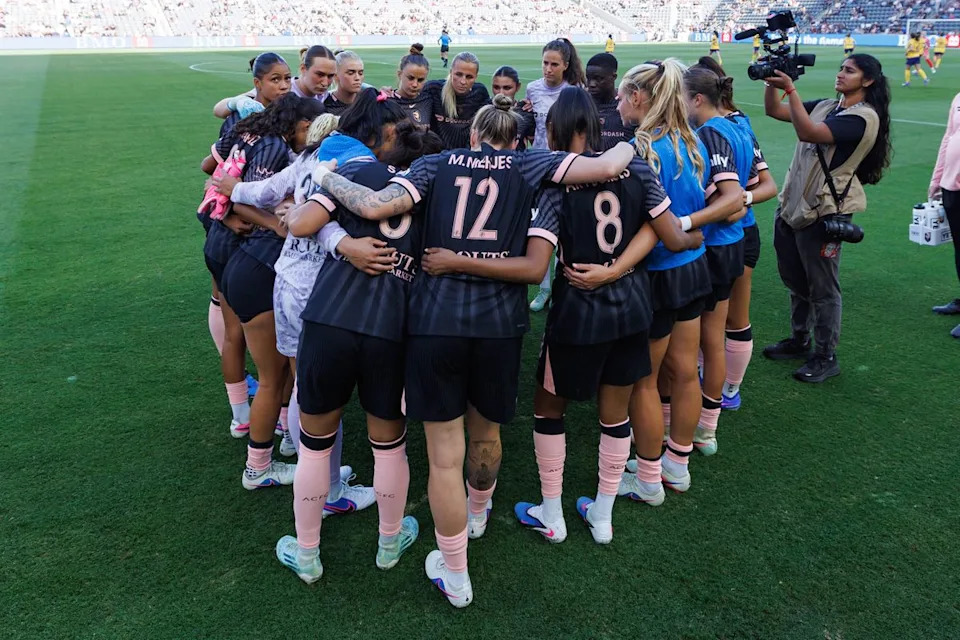 Angel City FC players get in a huddle before an NWSL match against the Utah Royals on May 2, 2026 at BMO Stadium in Los Angeles, California.